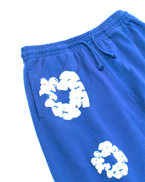 DENIM TEARS - Cotton Wreath Open Hem Sweatpants - (Blue)