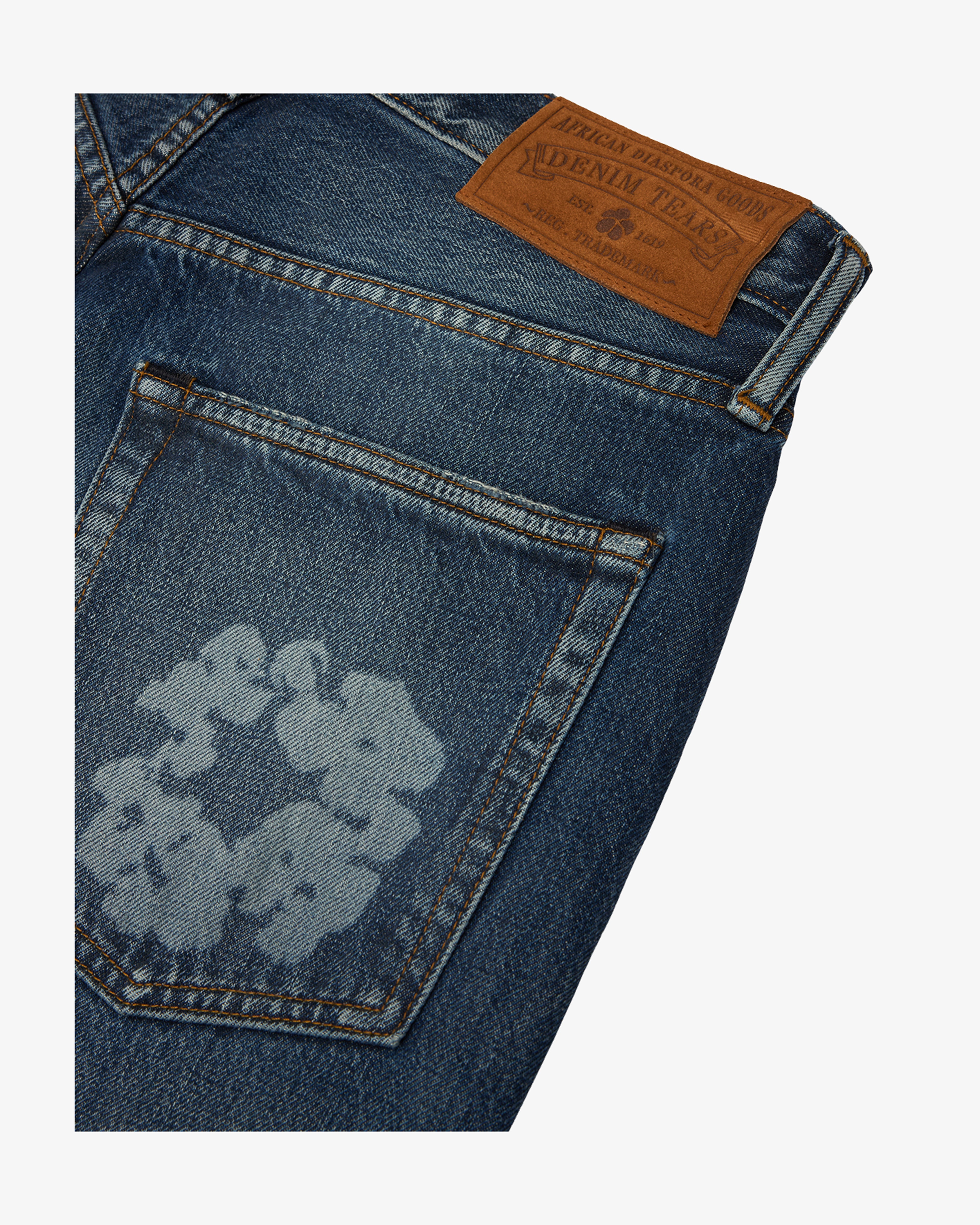 DENIM TEARS: Baggy Laser Cotton Wreath Denim Pant (Dark Wash