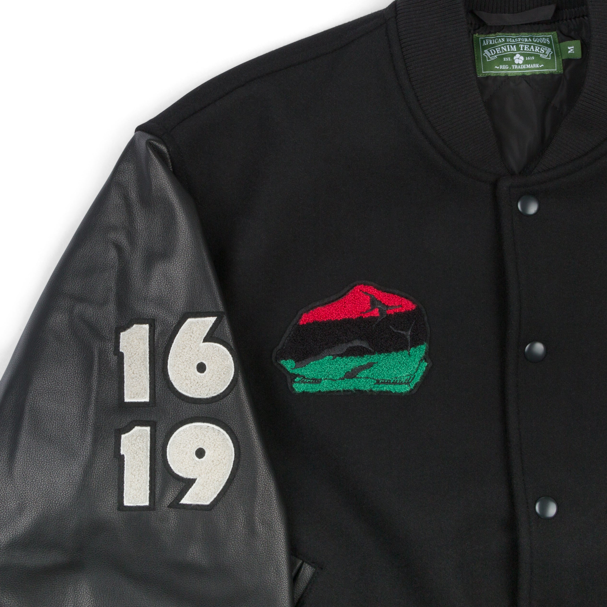 DENIM TEARS: Peace Wreath Varsity Jacket (Black) | DSMG E-SHOP